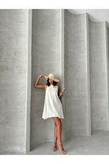 Aec Prive Keten yazlık elbise, beyaz renkte, şık bir tasarımla yaz sezonu için ideal